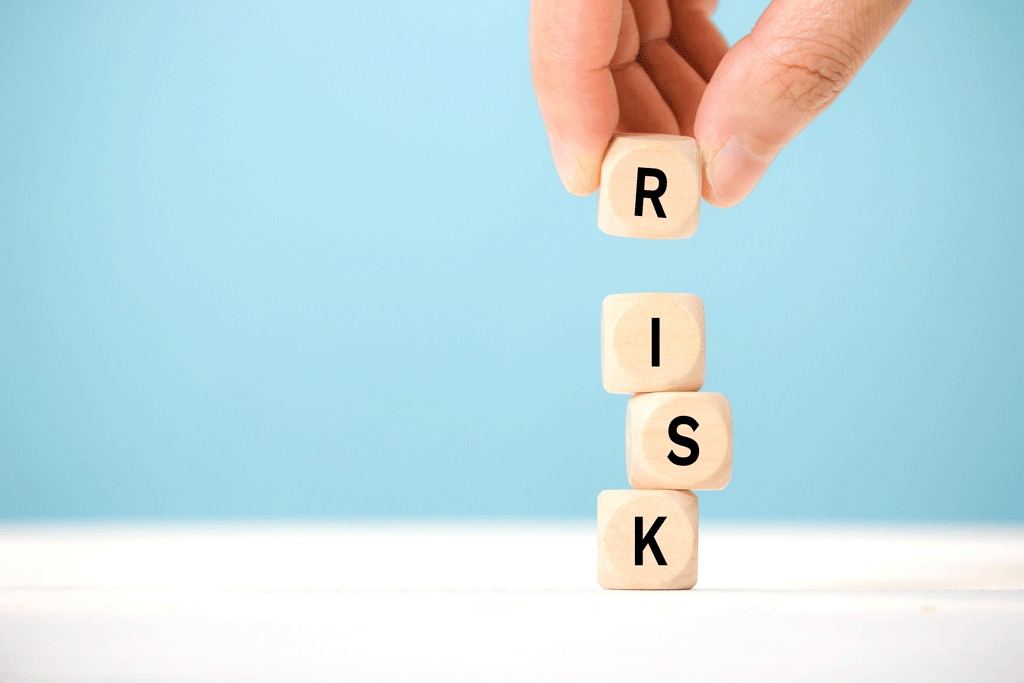 the word risk on wooden blocks with a blue background tree trimming service aledo tx ft worth tx prosper tx 