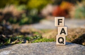 FAQ text on cubes standing on a stone on a natural background, Espalier training.